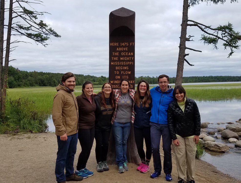 GPN students at the Mississippi Headwaters marker, a brown wooden monument
