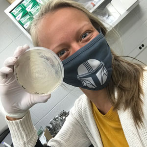 Katie takes a selfie with petri dish 