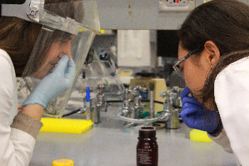Lien Phung and Megan McCarthy joking around in the lab