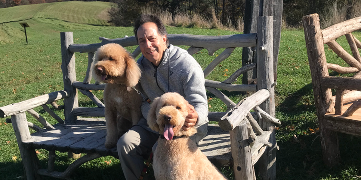 Russell Rothman with two dogs