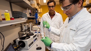 Sivaraj Sivaramakrishnan and Fred Sadler working in the lab