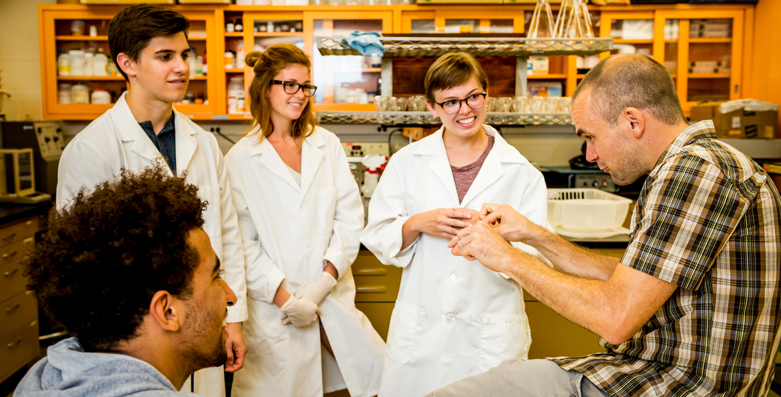 Peter Kennedy and students in research lab