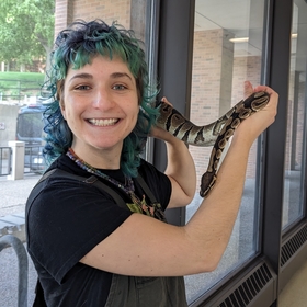Sabrina Marconie holding a snake