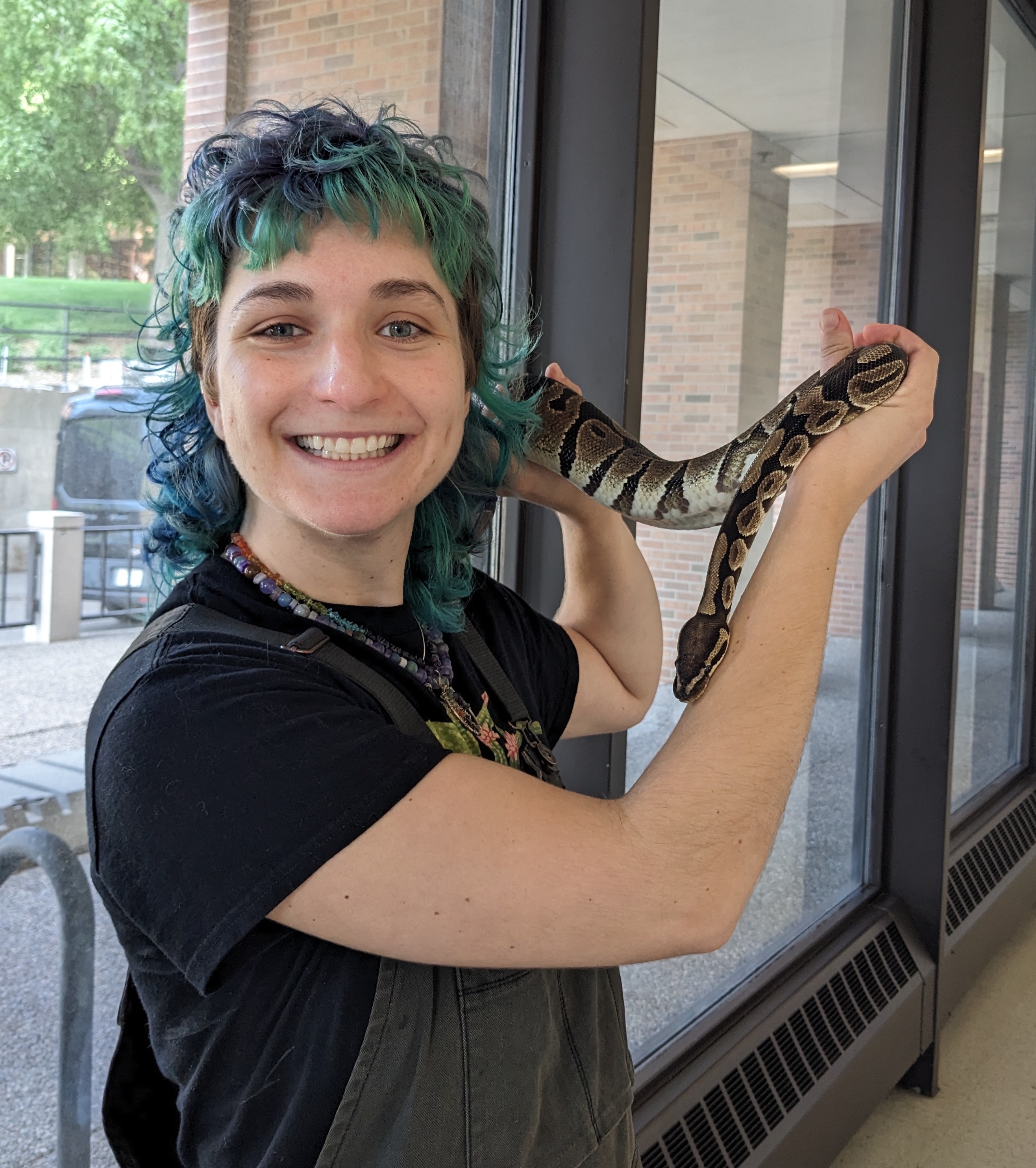 Sabrina Marconie holding a snake